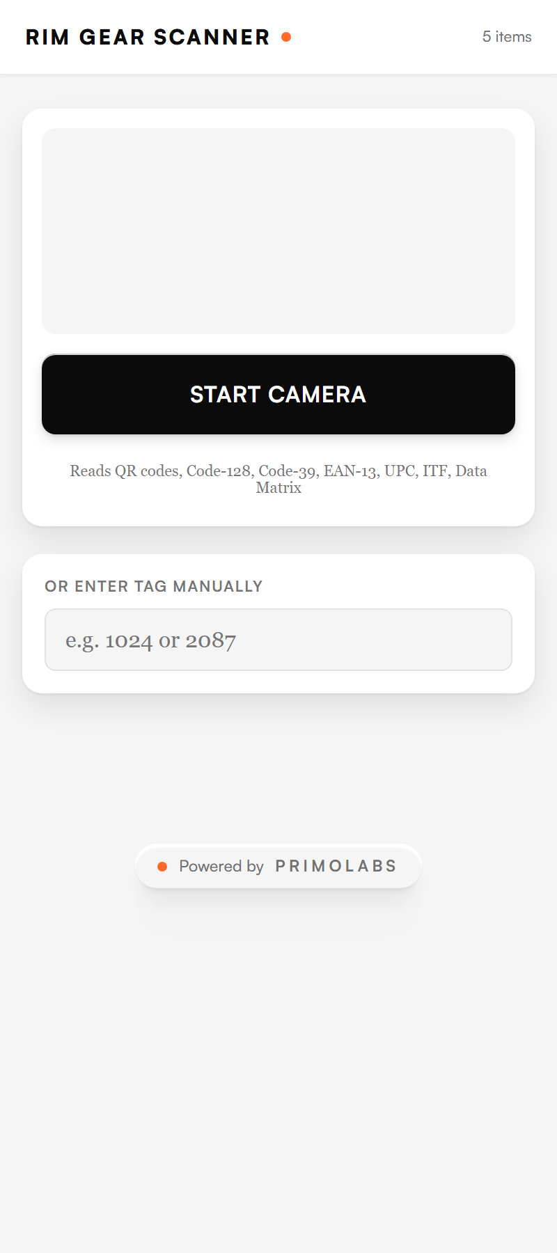 The scanner app on a phone: a camera viewport, a Start Camera button noting it reads QR, Code-128, and other symbologies, and a manual tag-entry field.